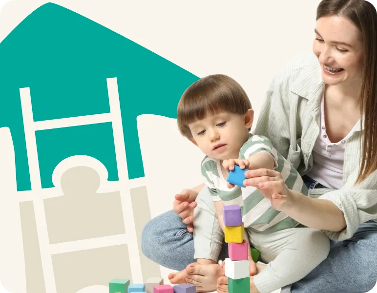 Mother and son playing with colorful building cubes