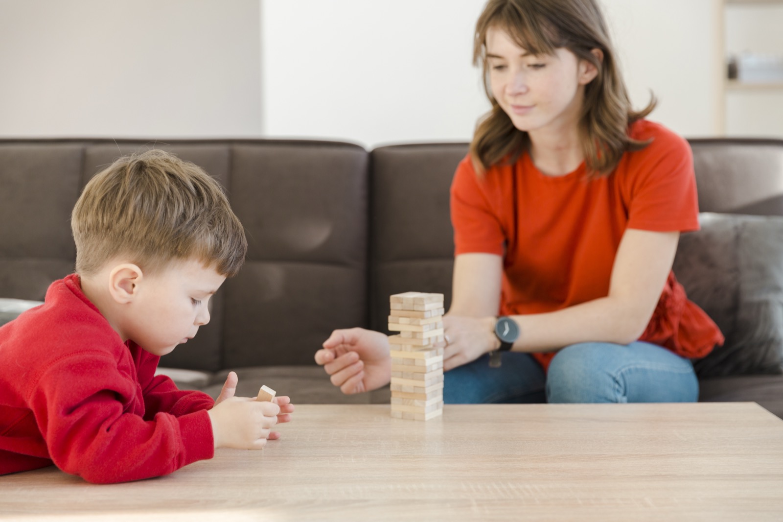 A boy concentrating on a stacking game