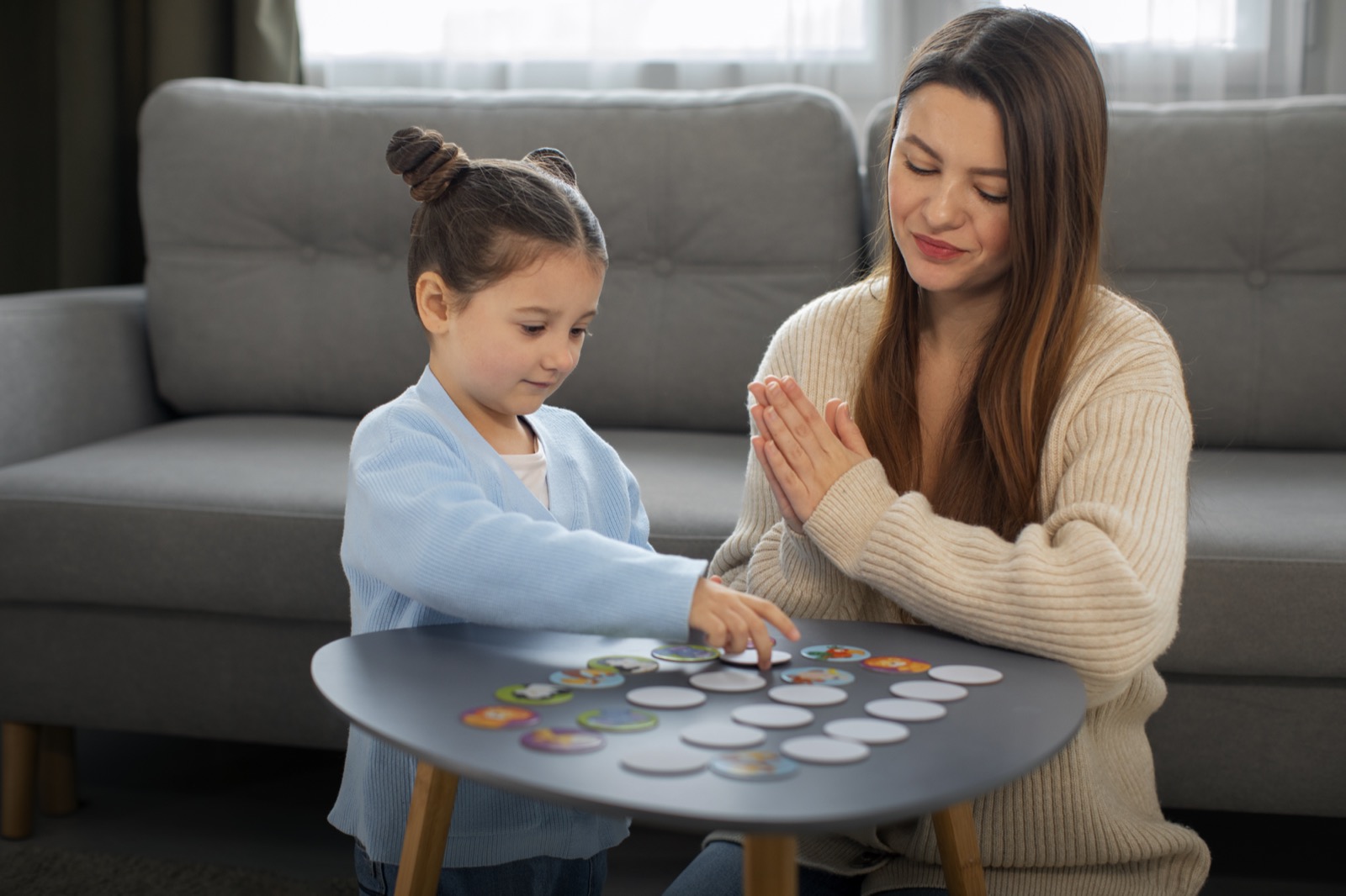 A mother and daughter playing a game together