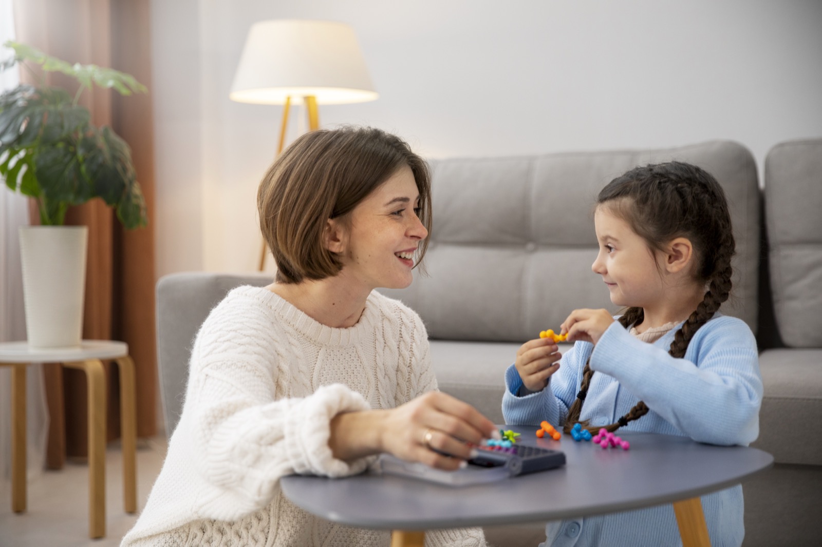 A mother and child playing a memory game