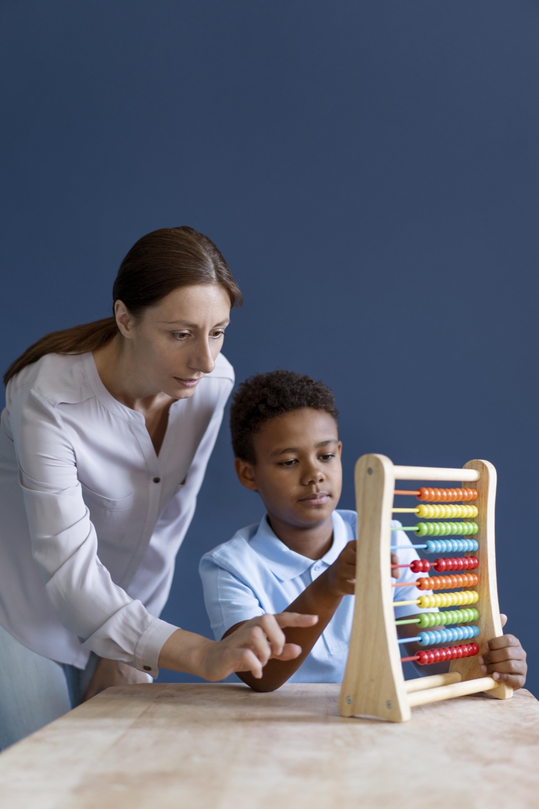 A young boy having an occupational therapy session with a psychologist