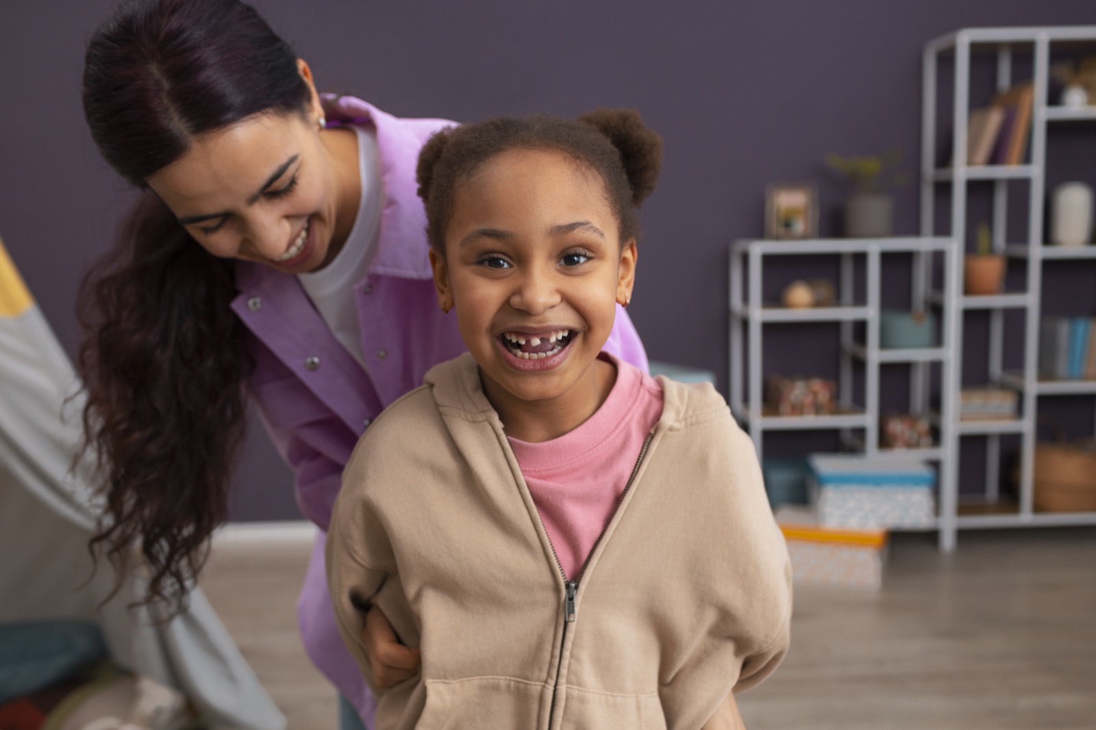A mother and daughter at home
