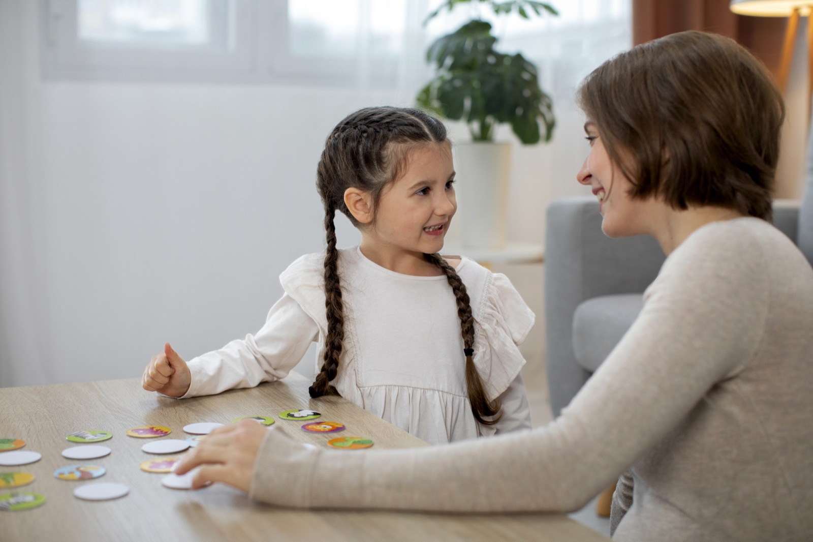 A mother and daughter playing a game together
