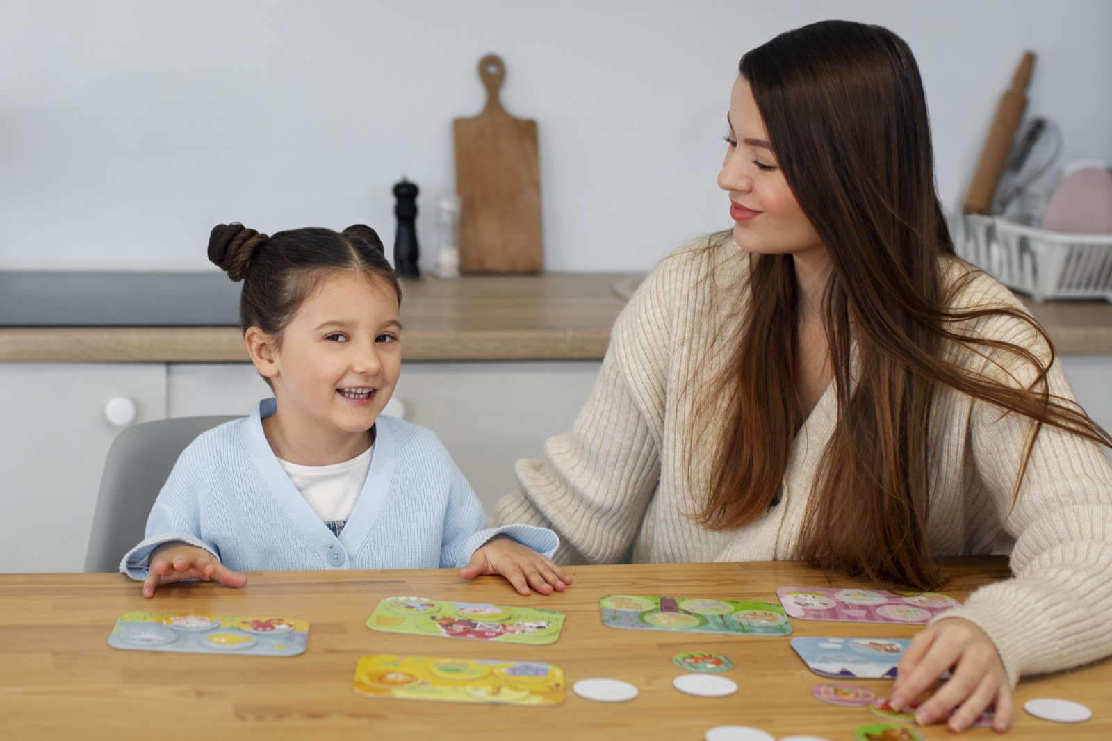 A mother and daughter playing a game together