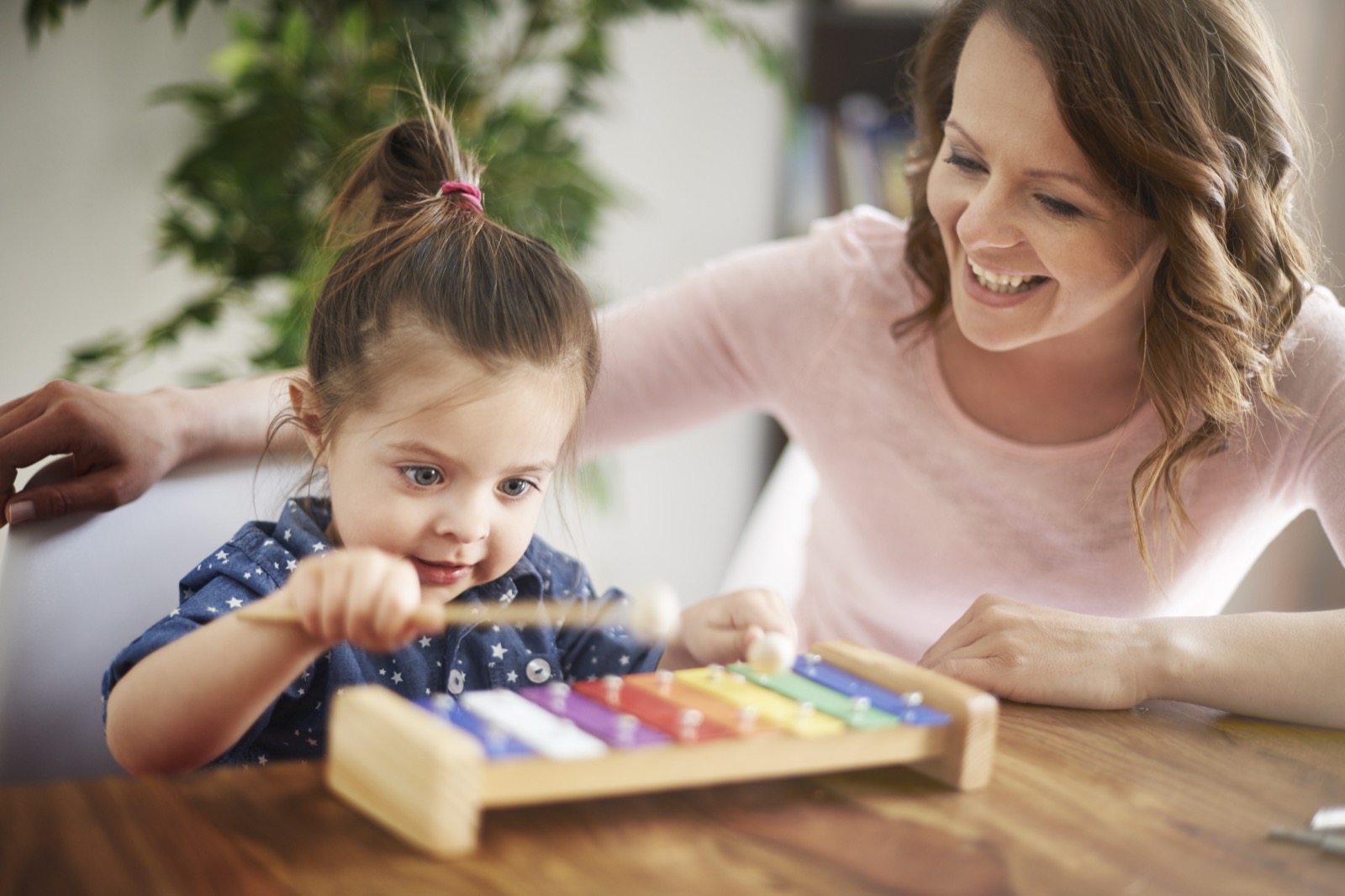 A mother and daughter playing together