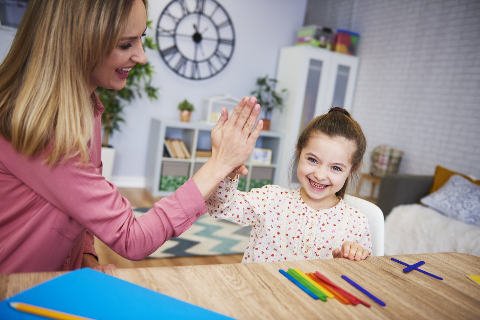 A mother teaching her child at home