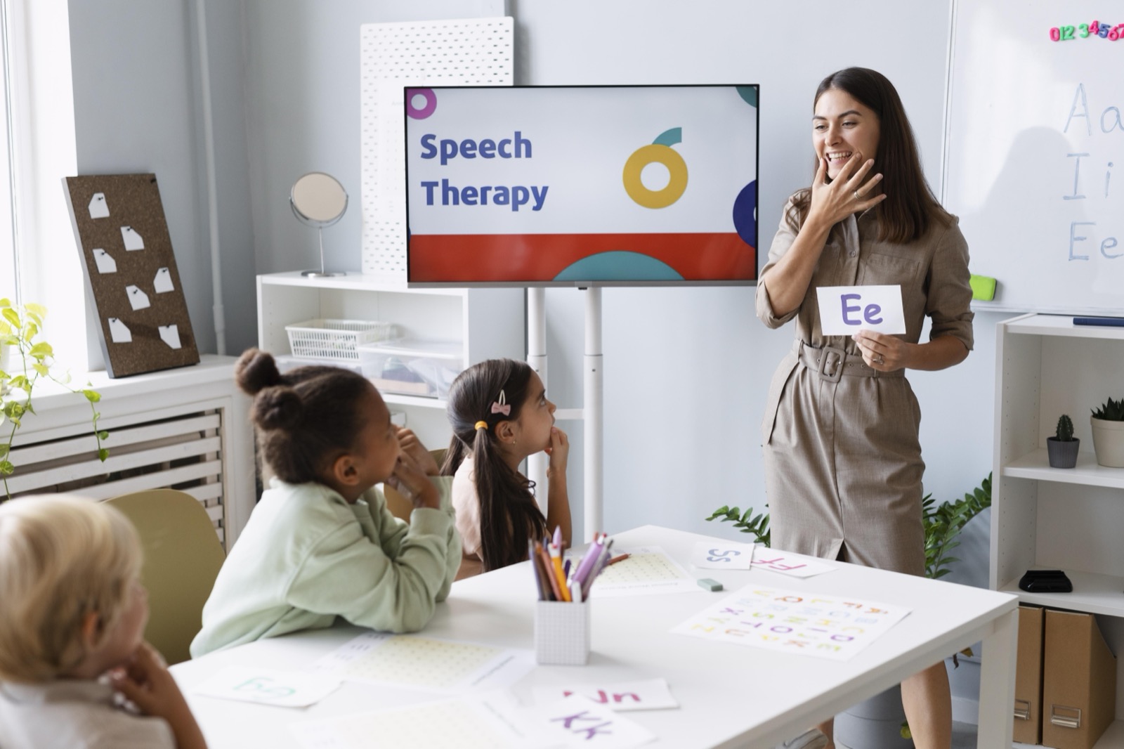 A therapist doing speech therapy with children