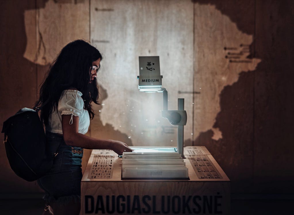 Free Woman Using Projector Stock Photo