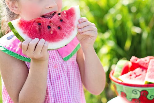 654eead4cc562899cad9b432 watermelon summer little girl eating watermelon food jpeg
