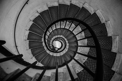 656e721f687c2dc92036d63f free photo of man at spiral staircase in black and white jpeg